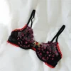 Lencería Negra Transparente con Bordados Florales Rosa y Borde Rojo