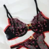 Lencería Negra Transparente con Bordados Florales Rosa y Borde Rojo
